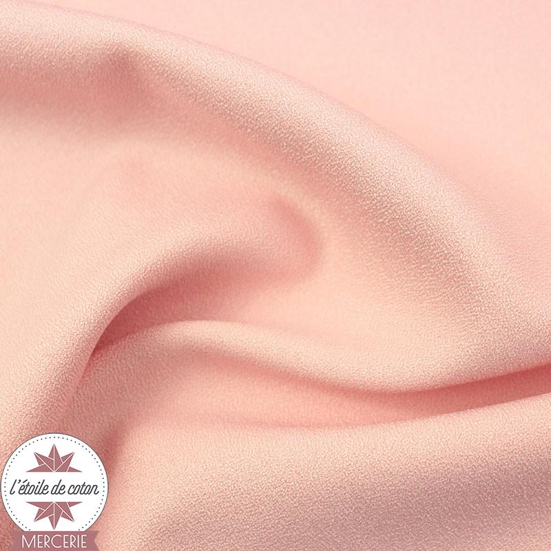 Tissu crêpe polyester uni rose clair