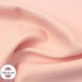 Tissu crêpe de polyester uni rose clair