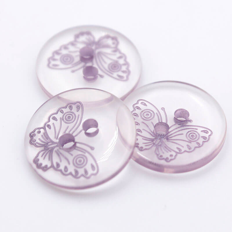 Bouton papillon transparent et violet